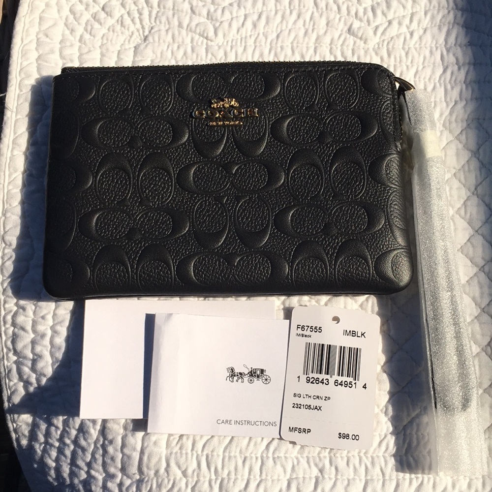 NWT Coach Wristlet in signature black leather. Perfect for formal & casual use